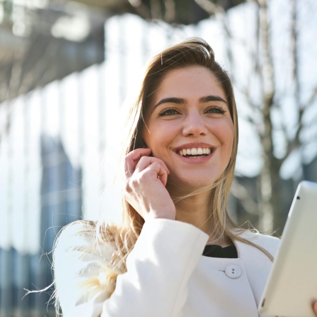 Woman In White Blazer Holding Tablet Computer